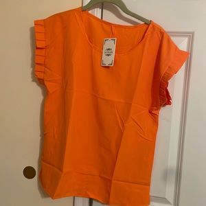 Orange cap sleeve shirt